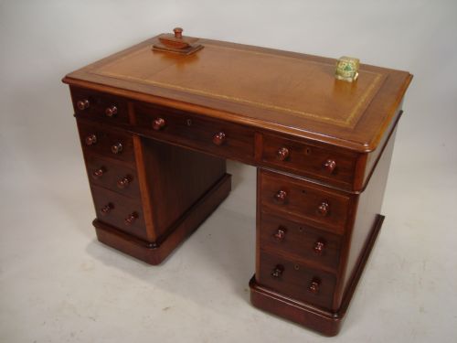 a victorian antique pedestal writing desk