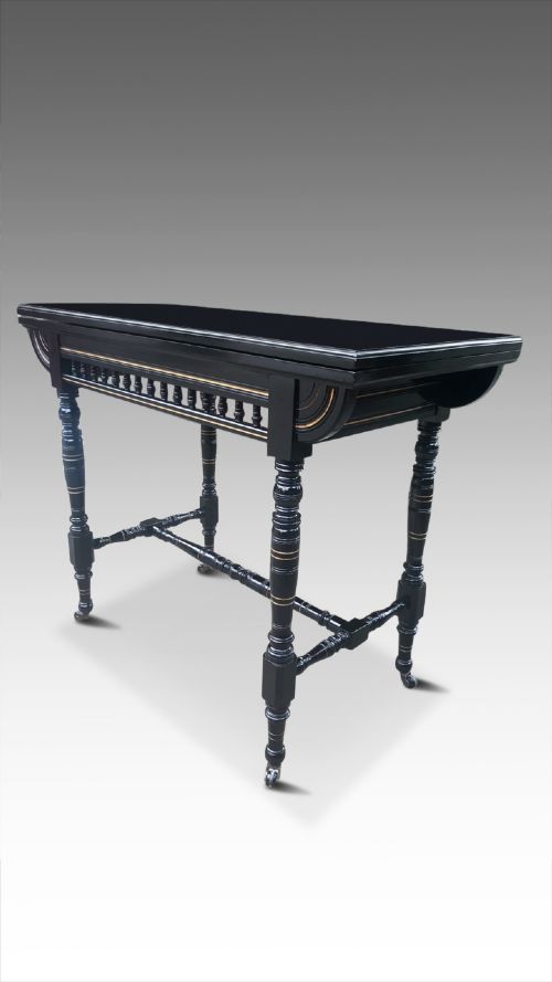 a victorian ebonised aesthetic side table card table
