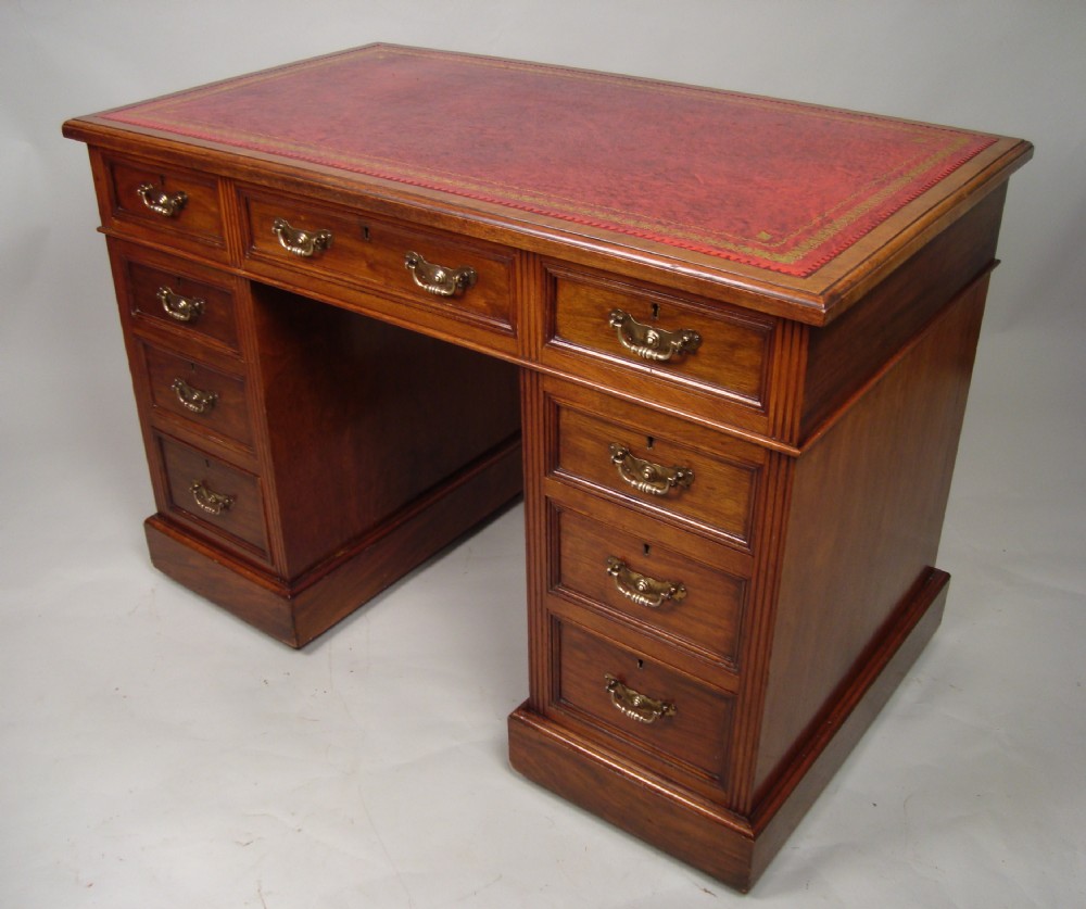 a very handsome edwardian walnut pedestal desk