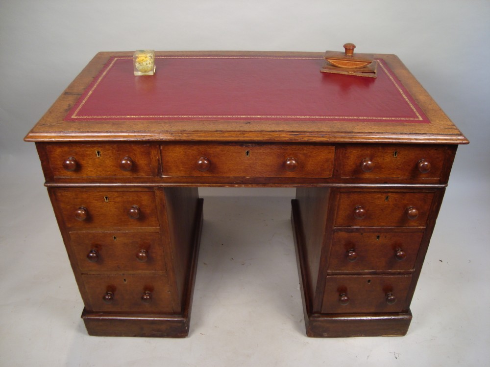 a victorian oak pedestal desk