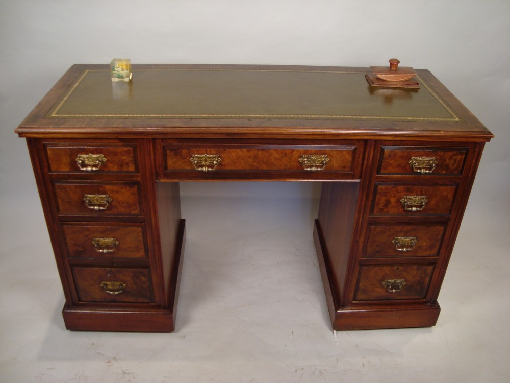 a very attractive burr walnut pedestal desk