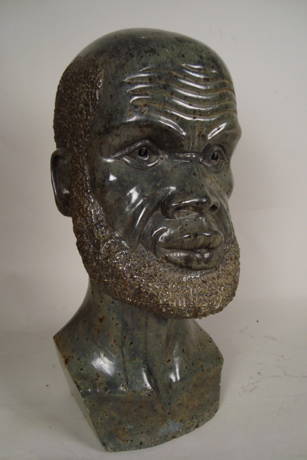 a large 1930's statue of an african man