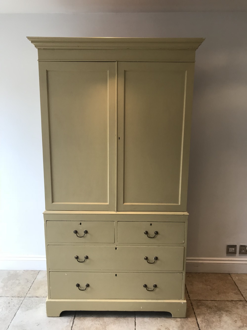 a very chic painted linen press wardrobe
