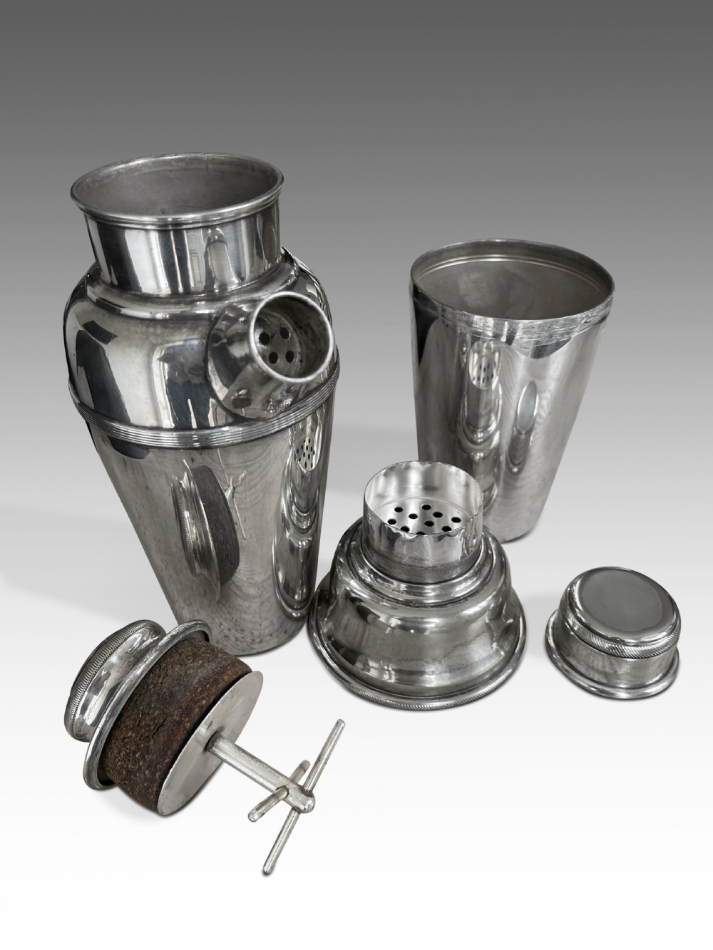a set of edwardian silver plate cocktail shakers