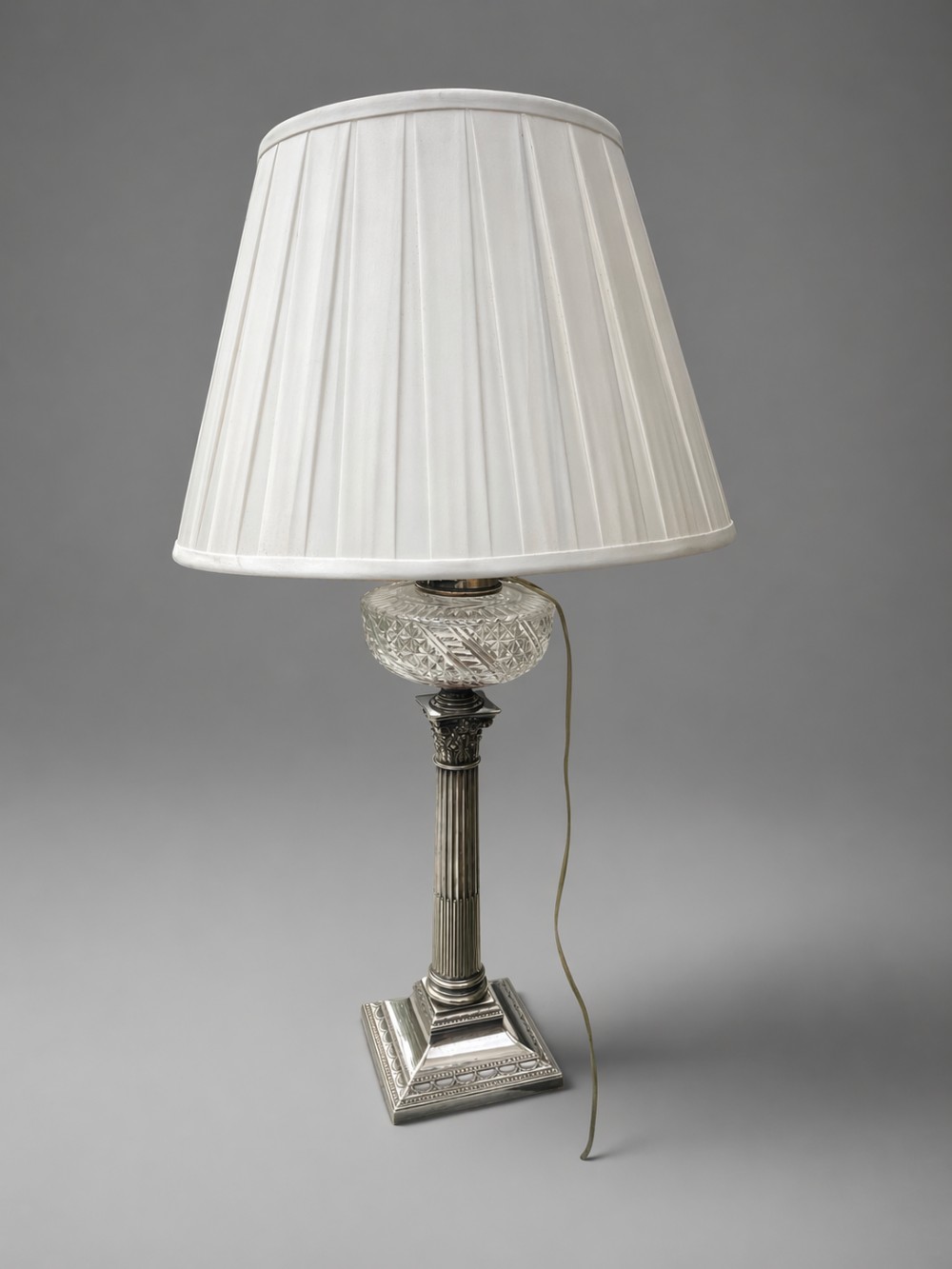 a handsome silver victorian lamp